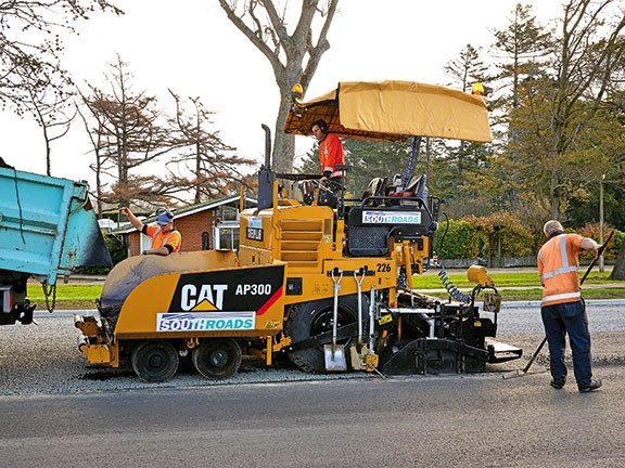 The Cat AP300 asphalt paver in action. The machine has increased on-site productivity.