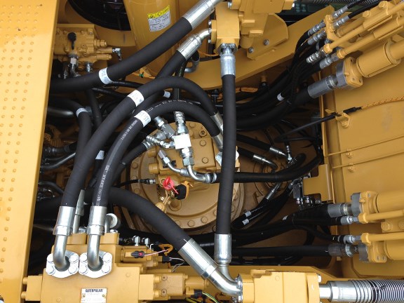 A view into the Cat 336EH’s engine compartment, showing the Adaptive Control System (ACS) valve.