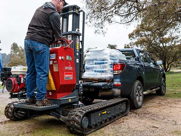 Pallet truck loads concrete on back of Mazda BT-50 ute