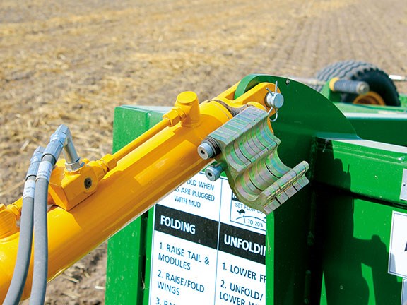A ram on the drawbar with spacer shims is used to keep the machine level