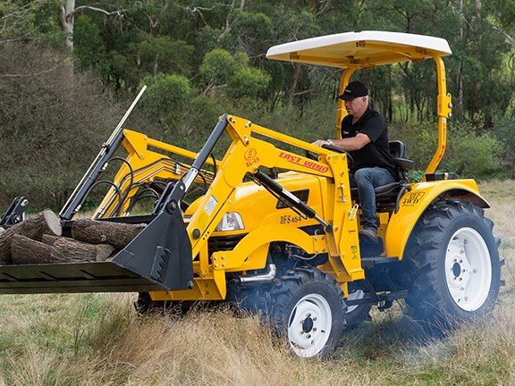 Tom Dickson on the East Wind DFS454 tractor
