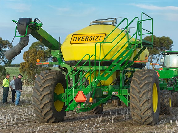 The John Deere 1910 Air Cart behind an 8320R tractor and an 1890 No-Till Air Drill