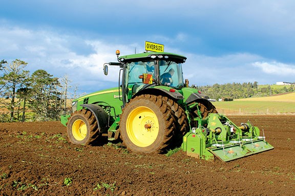 The John Deere 8235R with the 4m rotary hoe behind