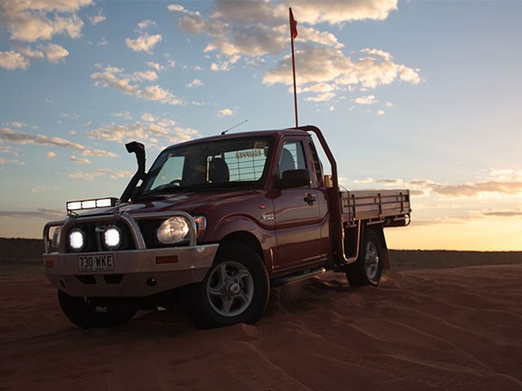 Mahindra pik up ute in desert sunset