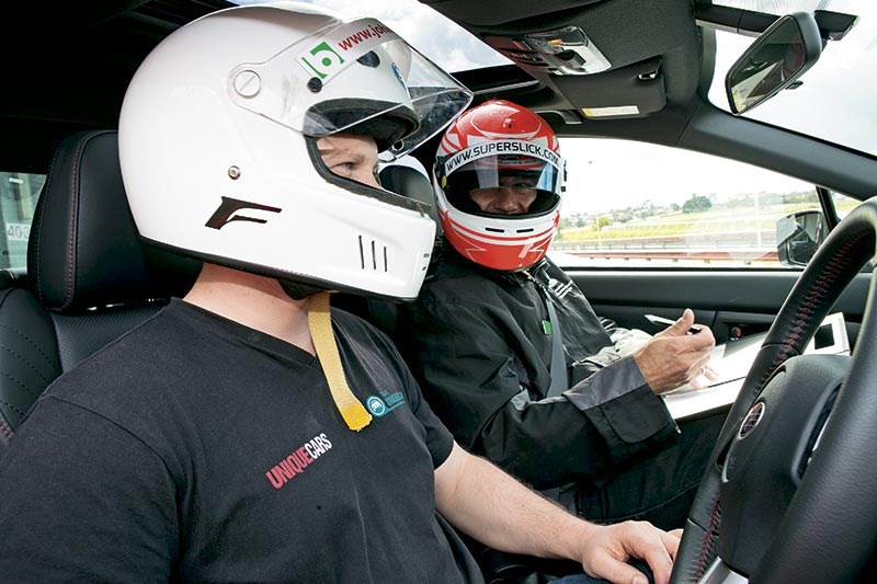 Instructor Iccy assesses and takes Scott through the finer points of the lap