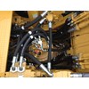 A view into the Cat 336EH’s engine compartment, showing the Adaptive Control System (ACS) valve.