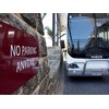 Bus parked outside hotel lobby