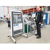 Darryl Wilson tries out the miniture bus door display at SMC's Melbourne warehouse