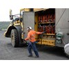 Service wroker refueling truck