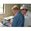 Ron Horner and Ron Shaw cutting opals