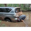 Nissan Patrol 4x4 stuck in river