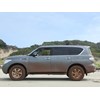 Side view of mud-covered Nissan Patrol 4x4