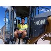 Russell ‘The Gun’ Lambert with Bulmer’s Cat 140M grader.