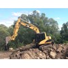 The Cat 311cu has spent a lot of time on rock work.