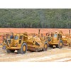 Cat 637 D and E model scrapers working in tandem.