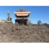 The Hitachi AH400 ADT has to deal with oozing, sloppy mud, steep inclines and unstable, wet gullies.