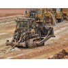 A Komatsu D155A dozer pre-rips the borrow pit. Love the camo paint job.