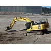 The Komatsu PC300-8 excavator at work trimming batters.