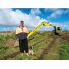 Richard Lambly and his 10-tonne Kobelco SK100 excavator fitted with a long-reach arm.