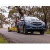 Mazda BT-50 towing excavator downhill