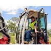 Reviewer Evarn Covich in the cab of the the Takeuchi TB280FR excavator.