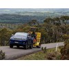 Toyota Hilux ute towing excavator on trailer
