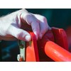 Man pinching gauge steel of tractor
