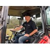 Tom Dickson sitting in the Branson 6225Ch tractor