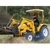 Tom Dickson on the East Wind DFS454 tractor