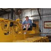 A pensive Denis Cleary on the immaculately restored 1957 D7 ’dozer he operated as a teenager. It’s stored in the workshop built by his father Jack Cleary.