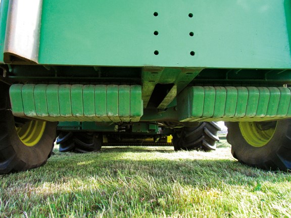 Counterweights are neatly concealed under the machine to provide ballast, particularly useful for heavy maize headers 