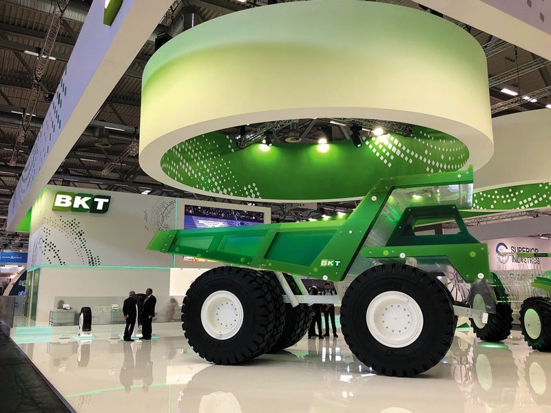 BKT Tires displays plexiglass dump truck and tractor