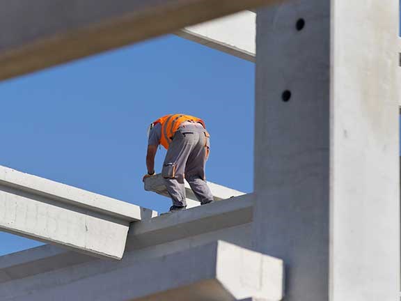 Construction worker up high without harness