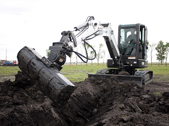 A Bobcat E50 compact excavator fitted with Hydra-Tilt and a grading bucket designed for tasks such as finish grading, cleaning ditches and back-filling.