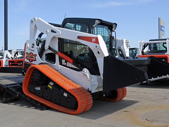 Ramps of sufficient strength are needed to support a compact loader when loading.