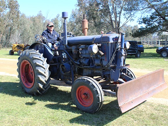A classic Fordson tractor fitted with a dozer blade.