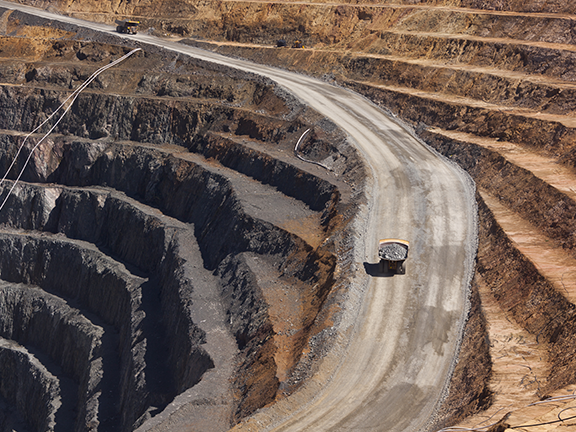 Trucks haul gold ore at Evolution Mining's Cowal gold mine in New South Wales.