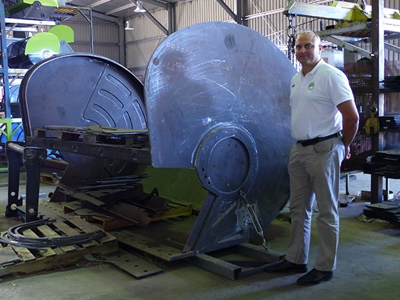 David Barkla with the 45-tonne excavator model on the assembly line