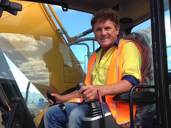 Ron Horner at the controls of a JCB JS220-LC excavator for an upcoming TradeEarthmovers review.