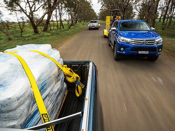 Fully loaded Toyota Hilux ute travelling at speed
