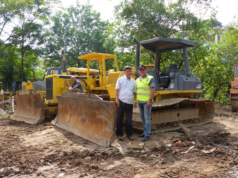 Le Van Dinh, the owner of the used machinery yard in Hanoi with Ron Horner.