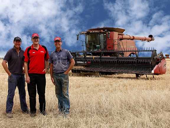 WA farmers Gary and Shaun Shadbolt (left and right) with Hutton and Northey Sales Mukinbudi branch manager Ian Clune. The Shadbolts are pleased with their latest acquisition, the Case IH Axial-Flow 7240 combine harvester.