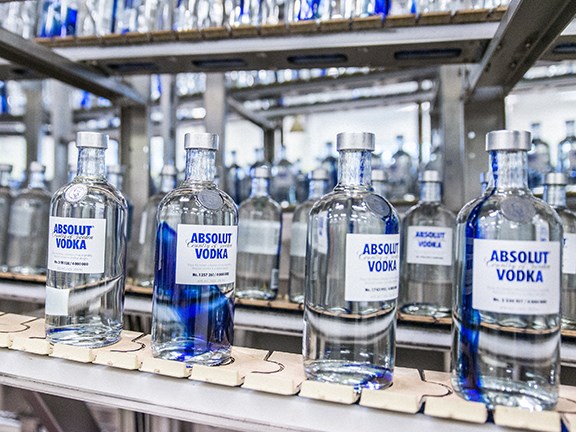 Absolut Originality vodka bottles on the conveyor belt.
