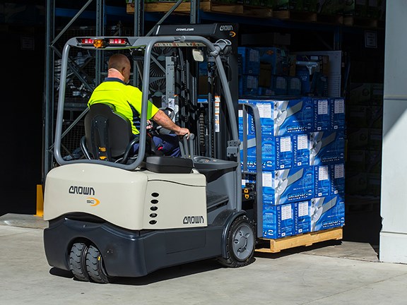 A Crown SC 4500 Series three-wheel, counterbalanced forklift in use at a Hunter Pacific International facility.