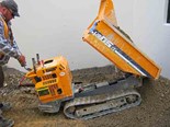 No, it's not a wheelbarrow with treads. The Yamaguchi WB05 is a proper dumper, albeit a rather small one.