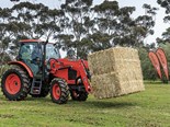 The Kubota M100GX tractor in action.