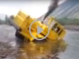 Video: Russian tractor stuck in a river