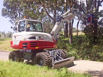 Takeuchi TB295W wheeled excavator equipment focus