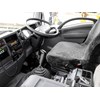 driver's seat and steering wheel in the Isuzu FXZ330 tipper truck