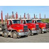 A trio of identical Mack CH loggers with consecutive number plates back in 2010